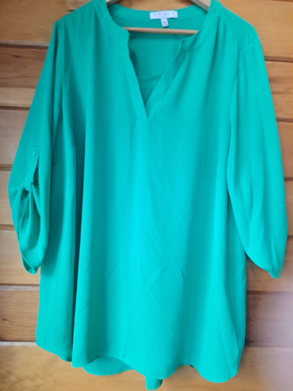 Chaus crepe top featuring a V-neckline and roll-tab sleeves. Green, 2x
